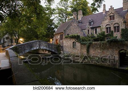 Picture - Quaint building and bridge over canal. Fotosearch