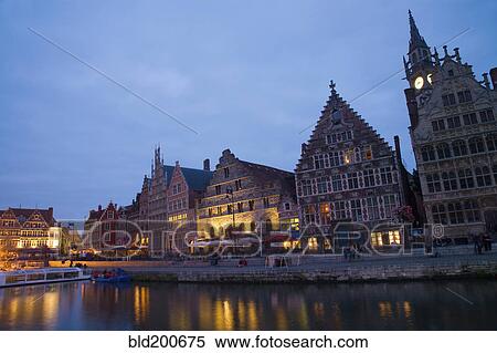 Stock Photography - Quaint buildings in town at night. Fotosearch