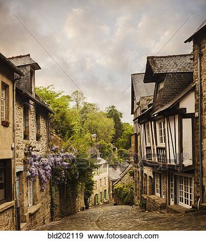 Stock Photo - Quaint French houses and cobblestone street. Fotosearch