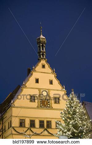 Stock Photo - Quaint, snow covered village decorated for Christmas. Fotosearch