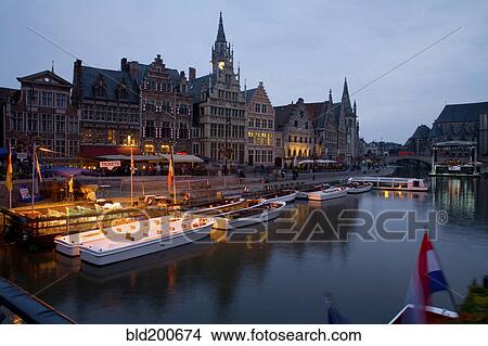 Picture - Quaint town and boats moored on canal. Fotosearch