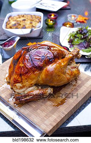 Stock Image - Roast turkey on cutting board. Fotosearch