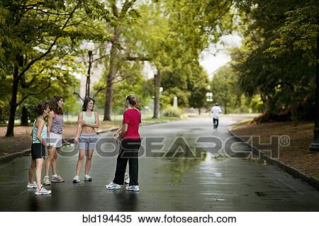 Runners talking in park View Large Photo Image Stock Photography - Runners talking in park. Fotosearch