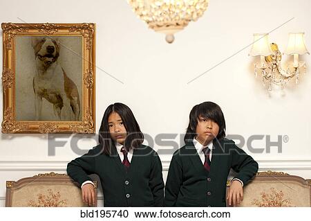 Sad Vietnamese children standing in elegant room View Large Photo Image Stock Image - Sad Vietnamese children standing in elegant room. Fotosearch