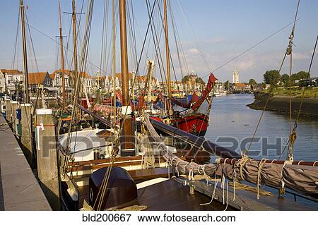 Sailboats moored in harbor View Large Photo Image Stock Photo - Sailboats moored in harbor. Fotosearch