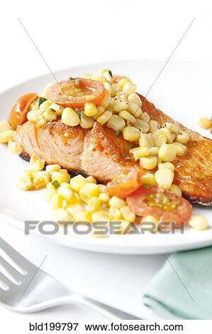 Stock Photo - Salmon and corn on plate. Fotosearch