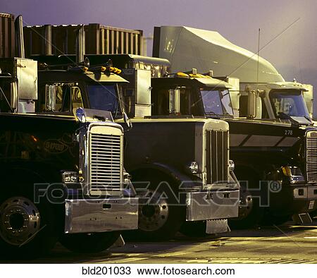 Stock Image - Semi-trucks in a row. Fotosearch