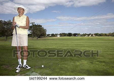 Picture - Senior Caucasian woman playing golf. Fotosearch