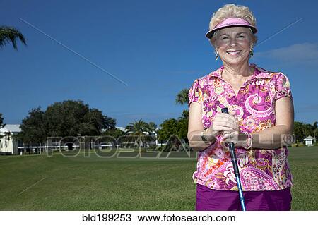Senior Caucasian woman playing golf View Large Photo Image Stock Image - Senior Caucasian woman playing golf. Fotosearch
