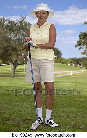 Senior Caucasian woman playing golf View Large Photo Image Stock Photography - Senior Caucasian woman playing golf. Fotosearch