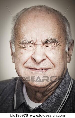Stock Photograph - Senior Hispanic man with eyes closed. Fotosearch