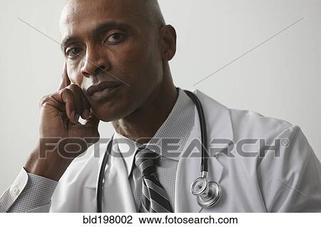Stock Image - Serious African American doctor. Fotosearch