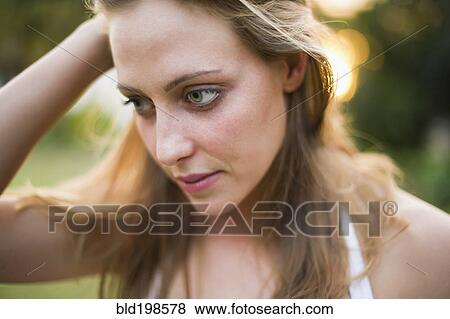Serious Brazilian woman with head in hands View Large Photo Image Stock Photo - Serious Brazilian woman with head in hands. Fotosearch
