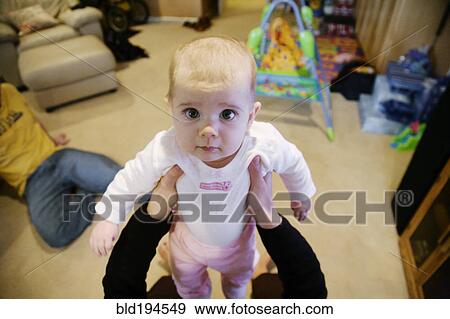 Stock Photo - Serious Caucasian baby girl. Fotosearch