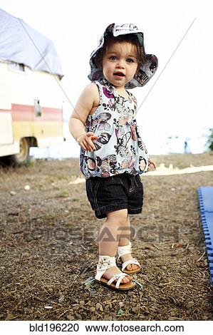Stock Image - Serious Caucasian girl camping. Fotosearch