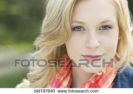 Stock Image - Serious Caucasian woman outdoors. Fotosearch
