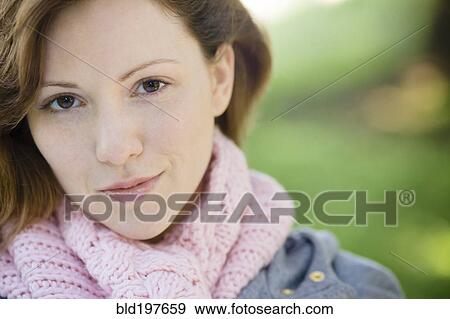 Stock Photo - Serious Caucasian woman outdoors. Fotosearch