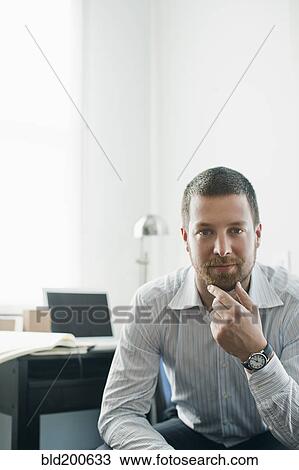 Stock Image - Serious Chinese businessman. Fotosearch
