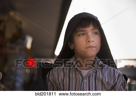 Stock Image - Serious Hispanic boy. Fotosearch