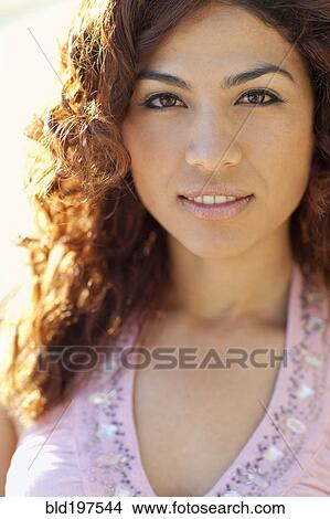 Picture - Serious Hispanic woman. Fotosearch