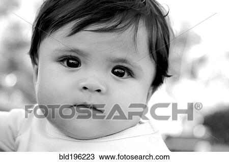 Stock Image - Serious mixed race girl. Fotosearch