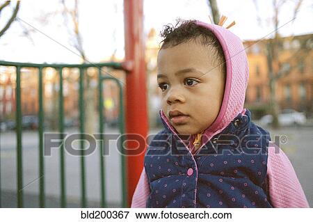 Stock Photo - Serious mixed race girl. Fotosearch