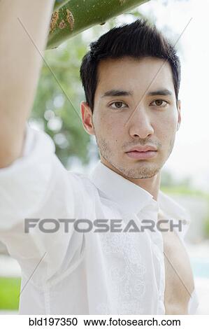 Stock Image - Serious mixed race man. Fotosearch