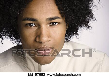Stock Image - Serious mixed race man. Fotosearch