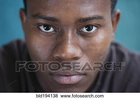 Stock Photo - Serious mixed race man. Fotosearch
