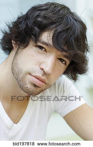 Stock Photo - Serious mixed race man. Fotosearch