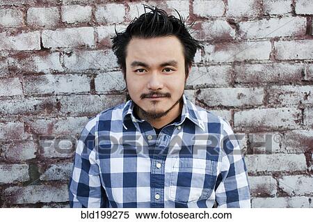 Stock Photography - Serious mixed race man. Fotosearch
