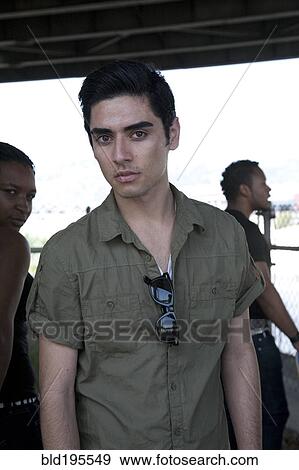 Stock Photo - Serious mixed race teenage boy. Fotosearch