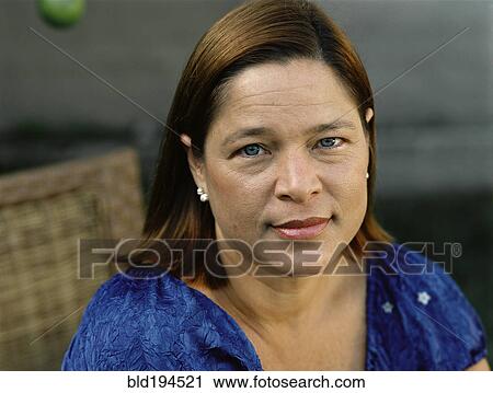 Stock Image - Serious mixed race woman. Fotosearch