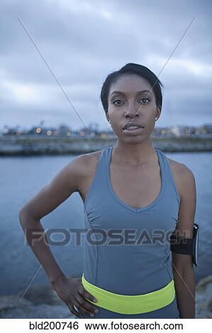 Serious runner in sportswear View Large Photo Image Stock Photograph - Serious runner in sportswear. Fotosearch