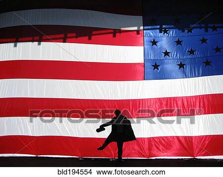 Silhouette of man behind American flag View Large Photo Image Picture - Silhouette of man behind American flag. Fotosearch