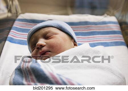 Stock Photography - Sleeping Caucasian newborn baby boy. Fotosearch