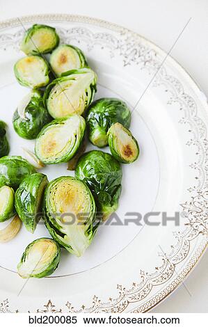 Sliced brussels sprouts on plate View Large Photo Image Stock Photography - Sliced brussels sprouts on plate. Fotosearch