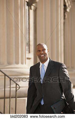 Stock Image - Smiling African American businessman. Fotosearch
