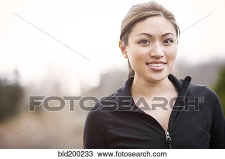 Stock Image - Smiling Asian woman. Fotosearch