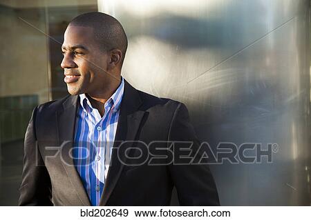 Stock Photo - Smiling Black businessman. Fotosearch