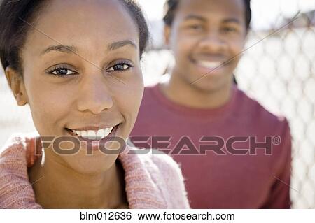 Stock Photograph - Smiling Black couple. Fotosearch