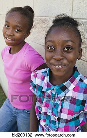 Stock Image - Smiling Black girls. Fotosearch