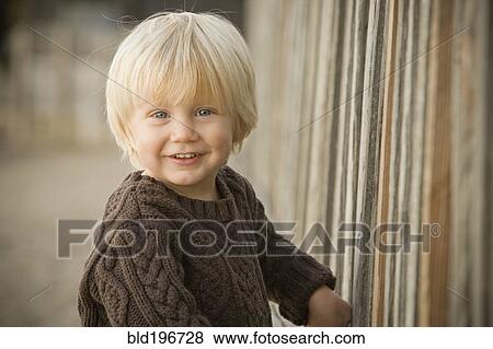 Stock Photo - Smiling Caucasian boy outdoors. Fotosearch
