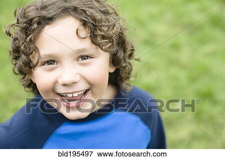 Stock Photo - Smiling Caucasian boy. Fotosearch