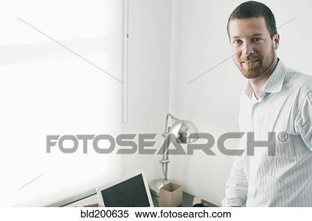 Stock Photography - Smiling Caucasian businessman. Fotosearch