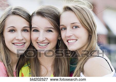 Stock Photo - Smiling Caucasian friends. Fotosearch