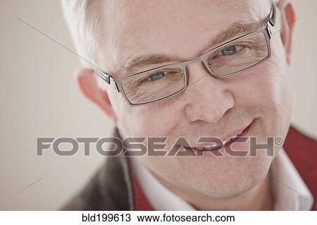 Stock Image - Smiling Caucasian man in eyeglasses. Fotosearch