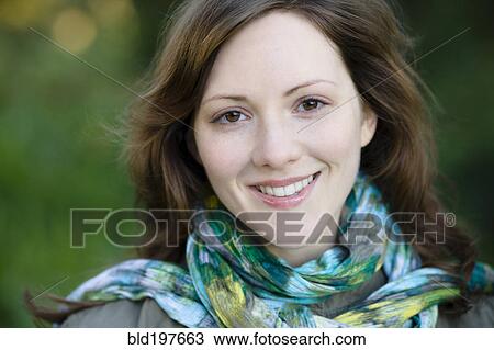 Smiling Caucasian woman outdoors View Large Photo Image Stock Image - Smiling Caucasian woman outdoors. Fotosearch