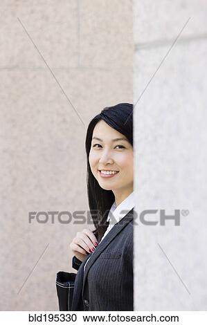 Stock Image - Smiling Chinese businesswoman. Fotosearch
