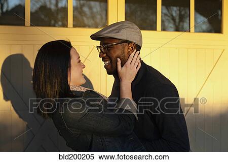 Smiling couple hugging View Large Photo Image Stock Photography - Smiling couple hugging. Fotosearch